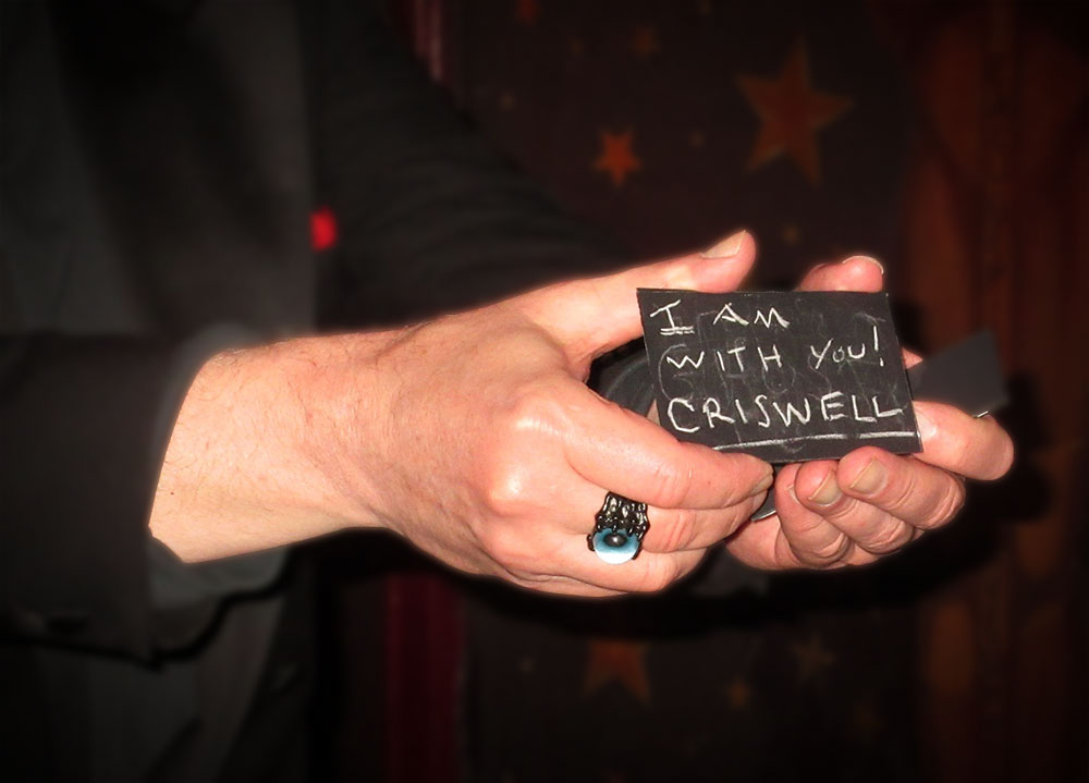 Hand holding a message from Criswell. Photo by Bob Blackburn