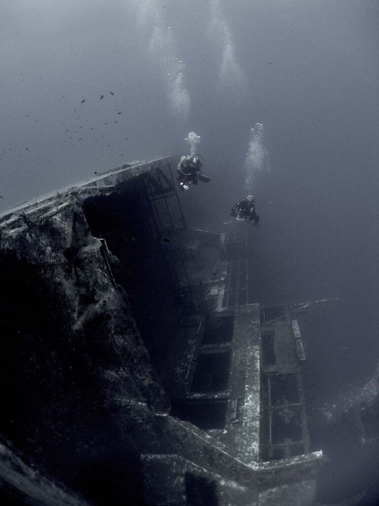 Two divers visiting the wreck of Zenobia.