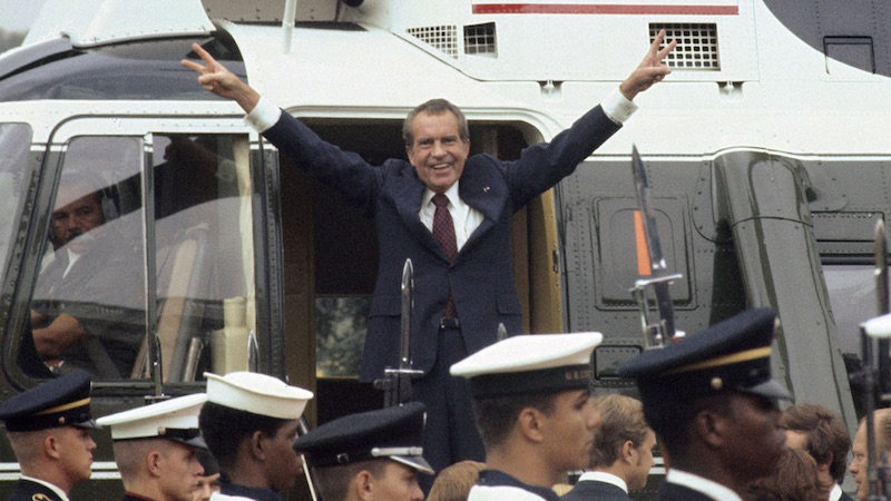 Richard Nixon smiling and waving