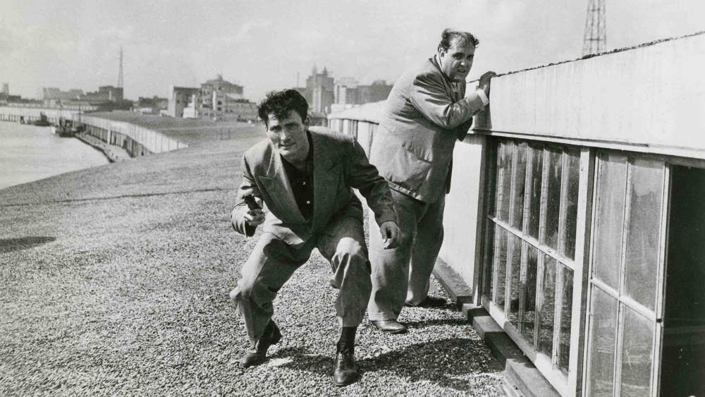 Panic in the Streets (1950). Jack Palance crouching with revolver and Zero Mostel behind him.